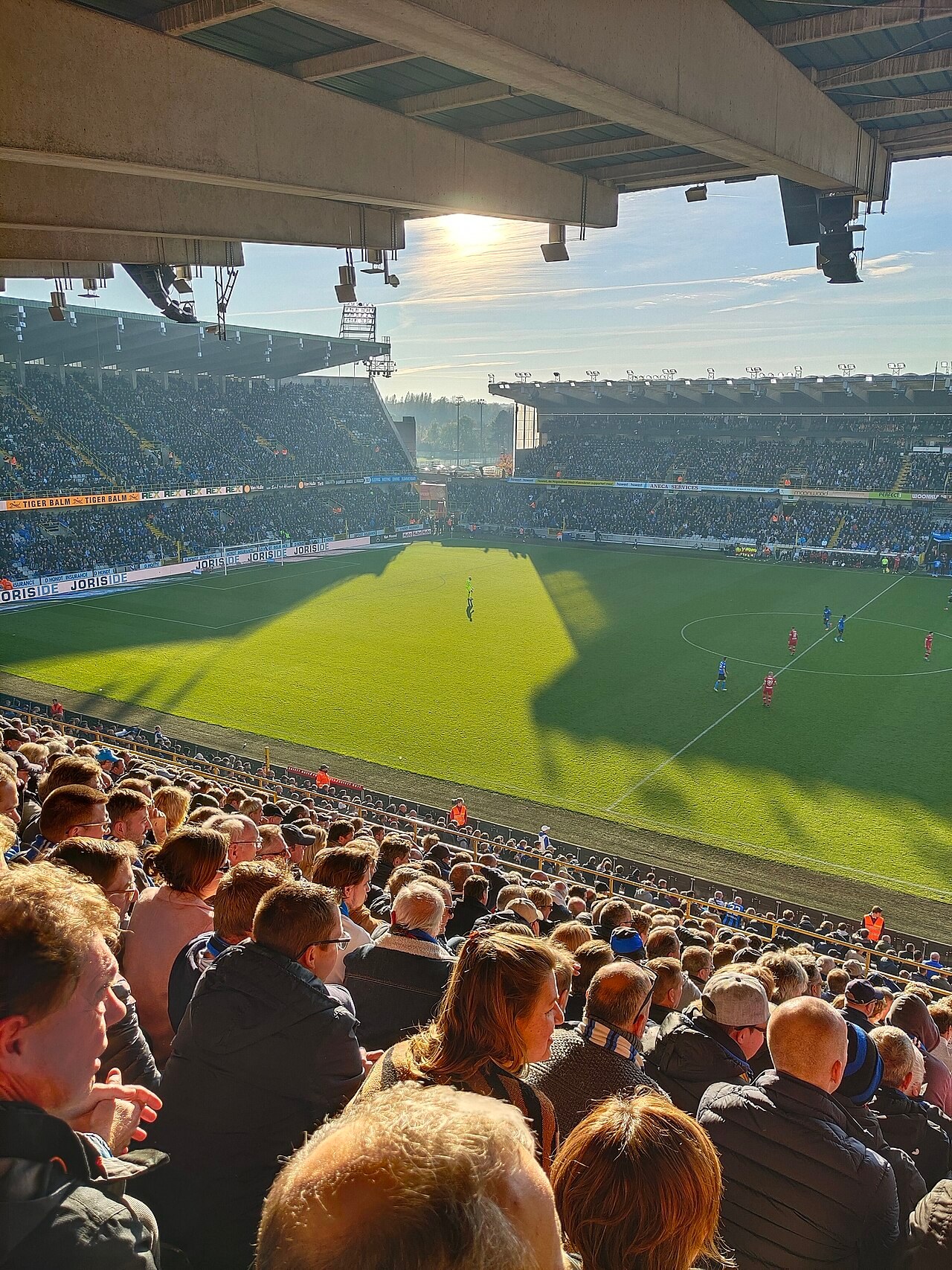 A full Jan Breydelstadion seen from among the home supporters, with Club Brugge playing in blue and black