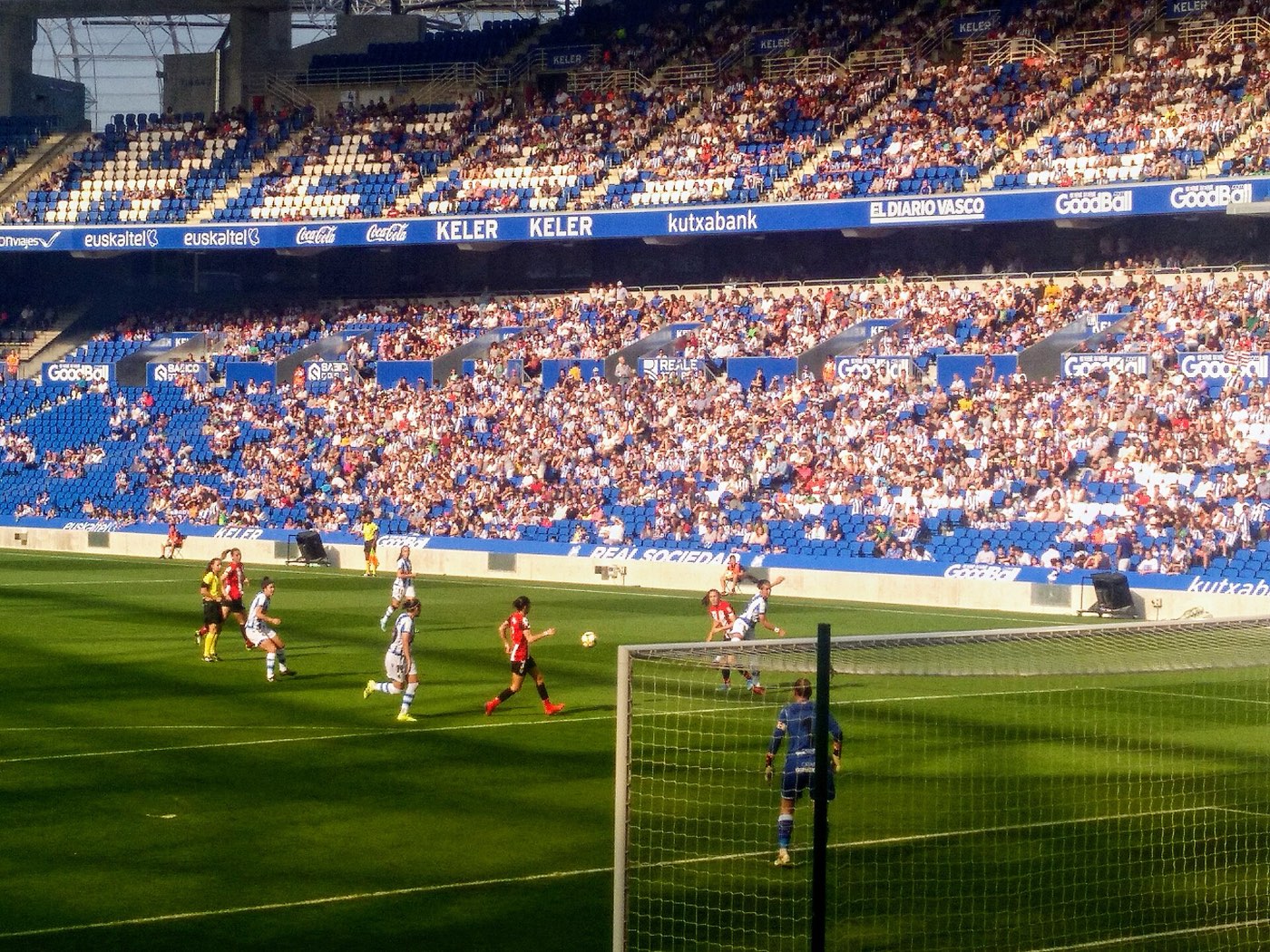 The rebuilt Anoeta stadium in San Sebastián, its stands busy and close to the pitch during a women's Basque derby