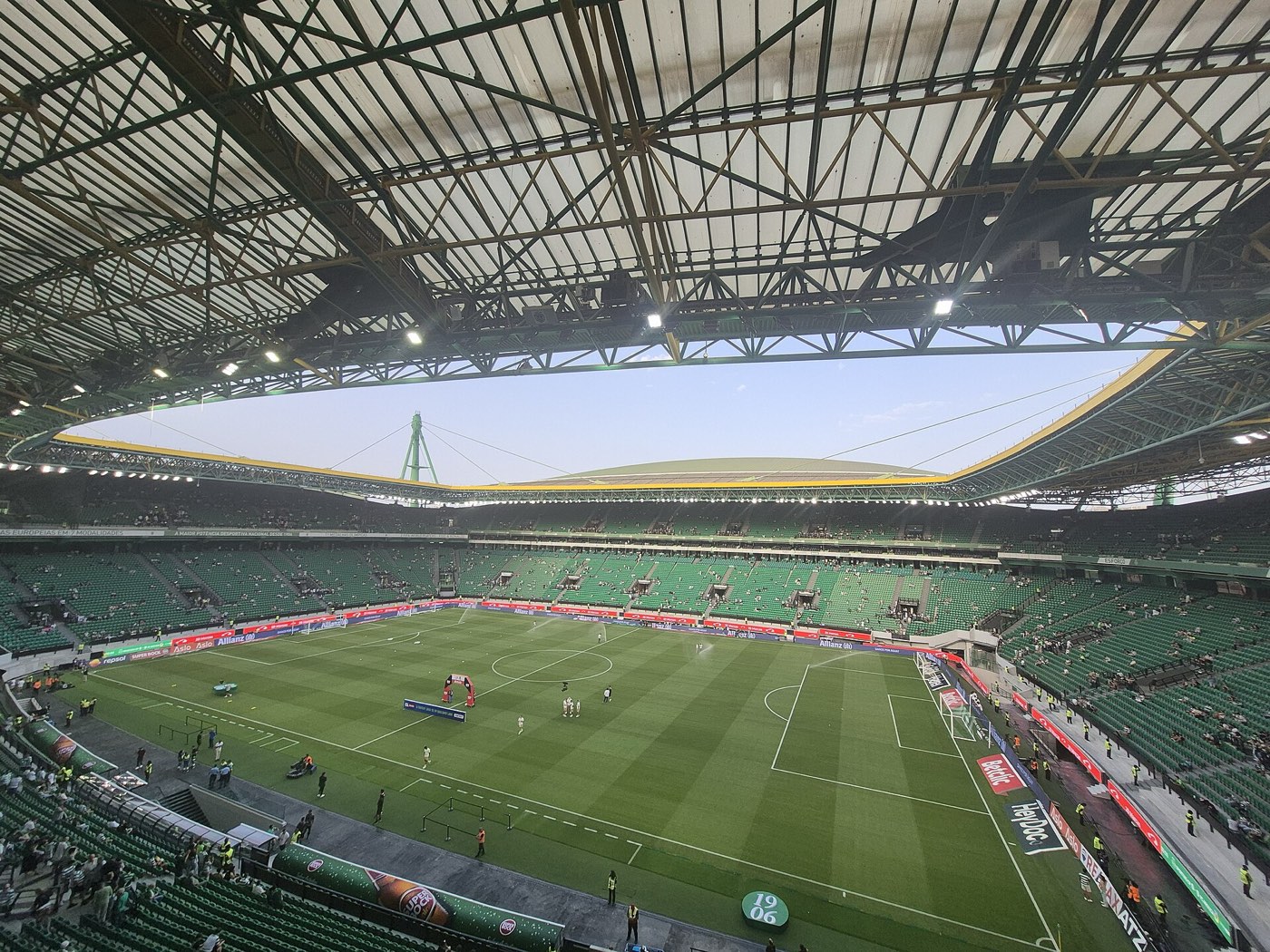 Inside the Estádio José Alvalade in Lisbon before a Sporting CP league match, green seats under the roof